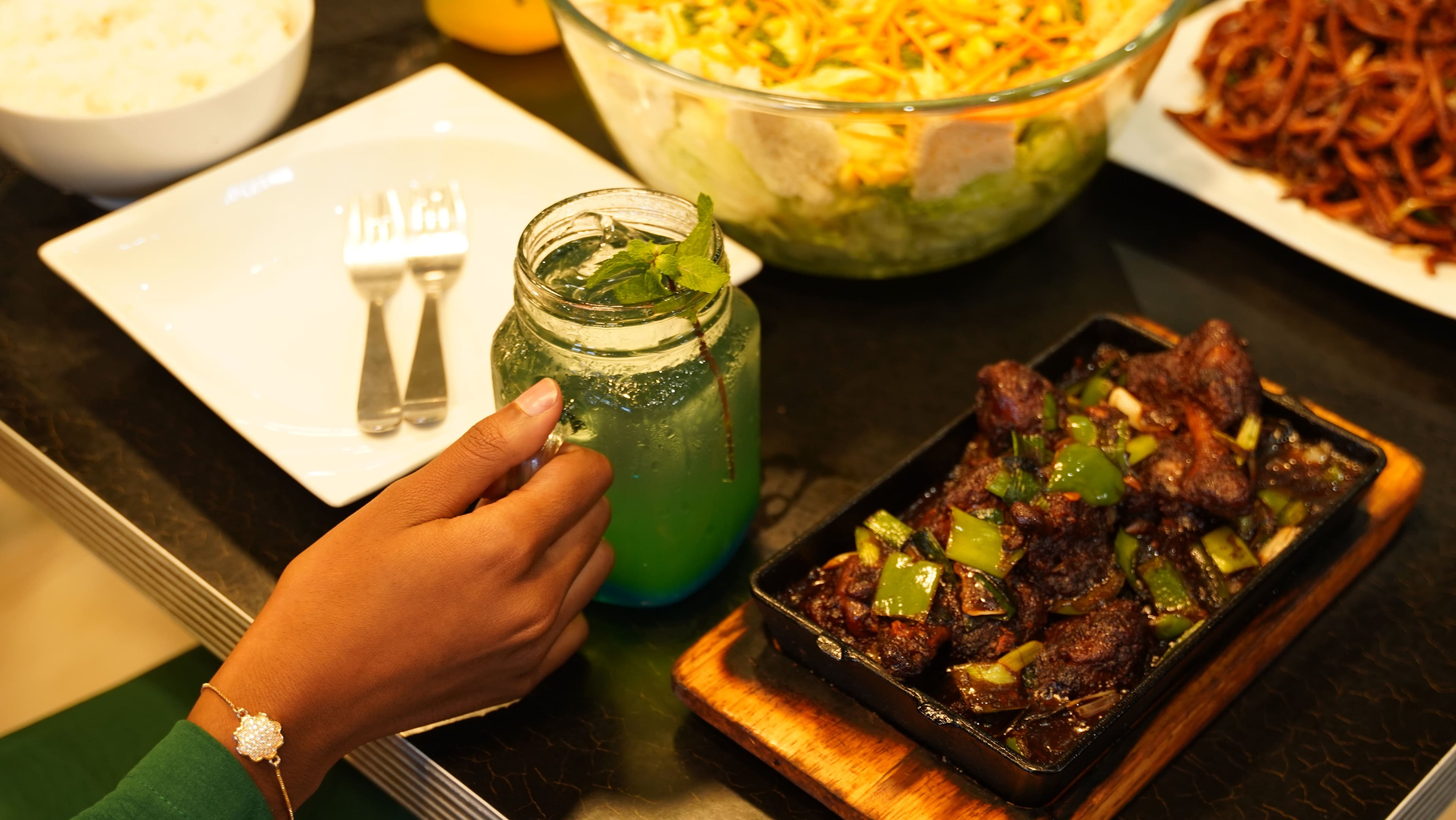 Chanoly dining experience with mojito and sizzling dish
